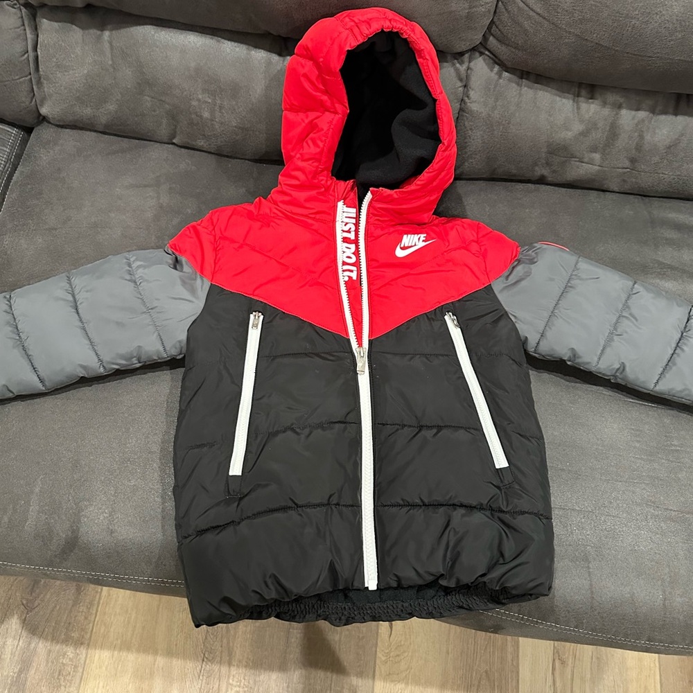 Red and gray Nike puffer jacket